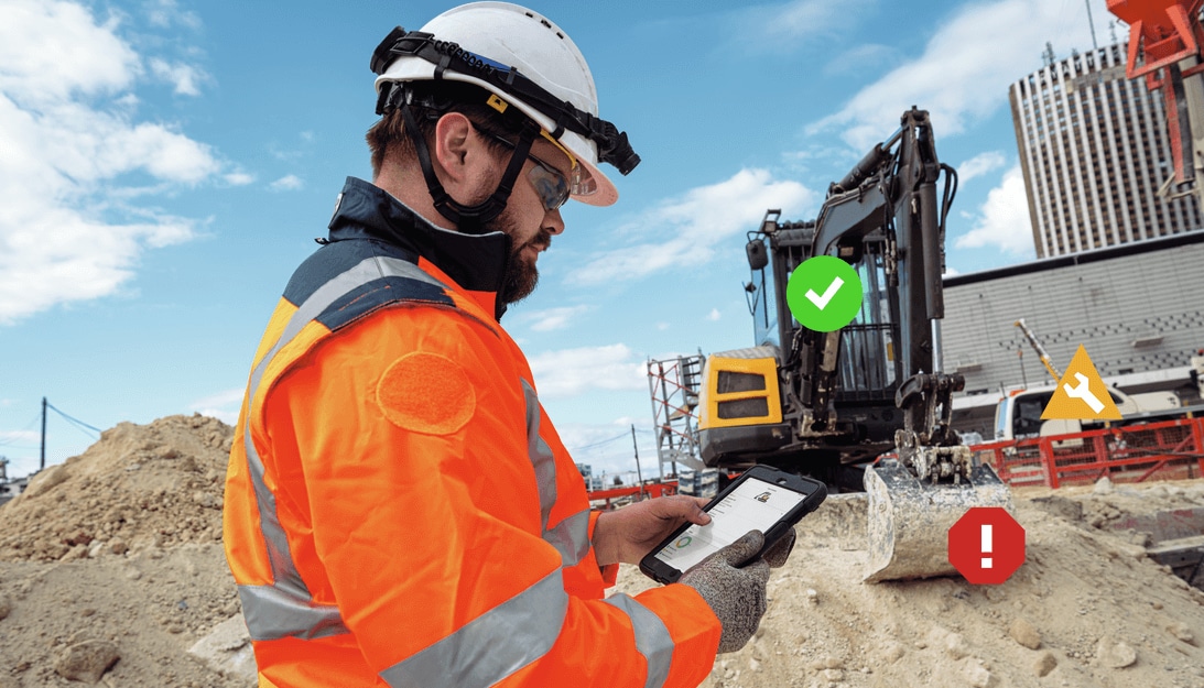 Ein Arbeiter hält sich auf der Baustelle auf und hat ein Tablet mit der Hilti ON!Track-Software darauf.