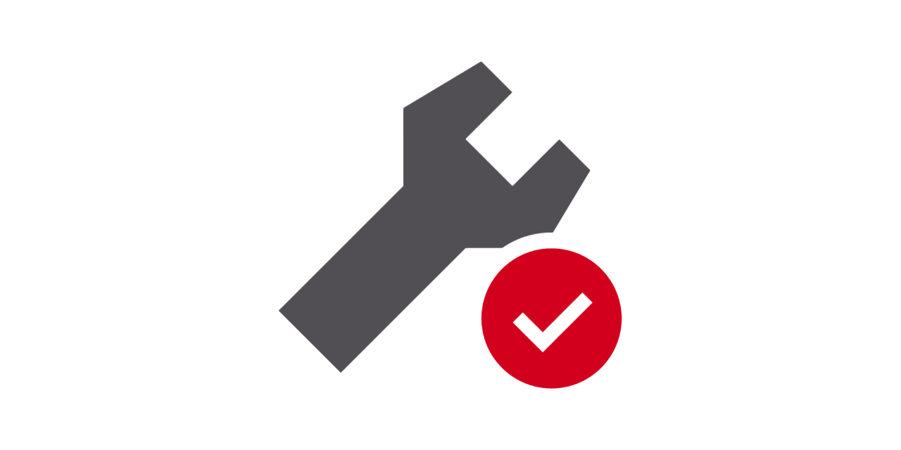 SPANNER ICON WITH TICK INSIDE A RED CIRCLE